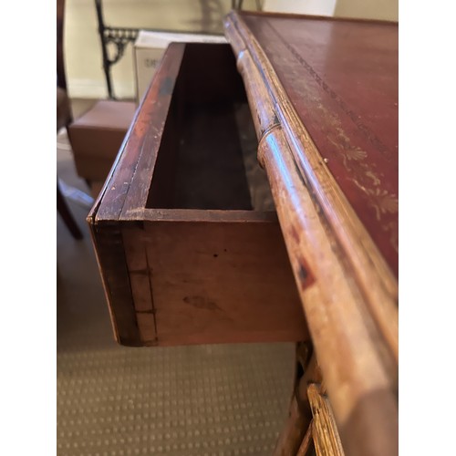 99 - A 19thC bamboo and lacquer kneehole desk with brass drop handles. 90cm w x 51cm d x 76cm h.