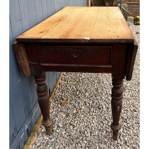 100 - A 19thC pine drop leaf table with drawers to each end. 119cm l x 66cm w with leaves down, 78cm h. 10... 