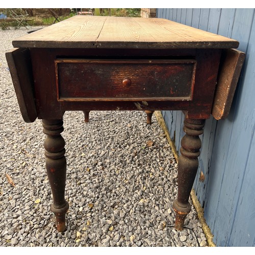 100 - A 19thC pine drop leaf table with drawers to each end. 119cm l x 66cm w with leaves down, 78cm h. 10... 