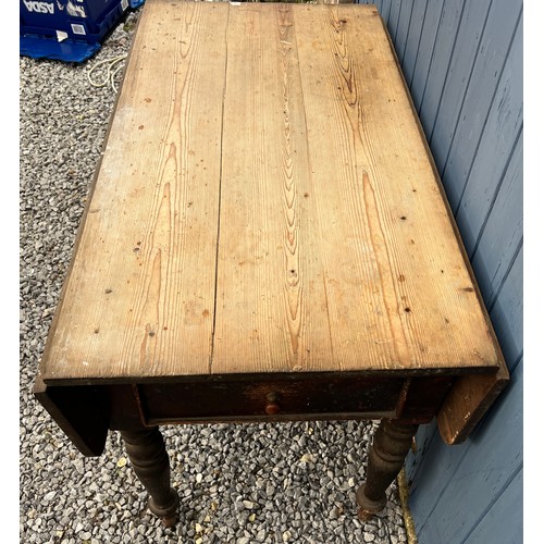 100 - A 19thC pine drop leaf table with drawers to each end. 119cm l x 66cm w with leaves down, 78cm h. 10... 