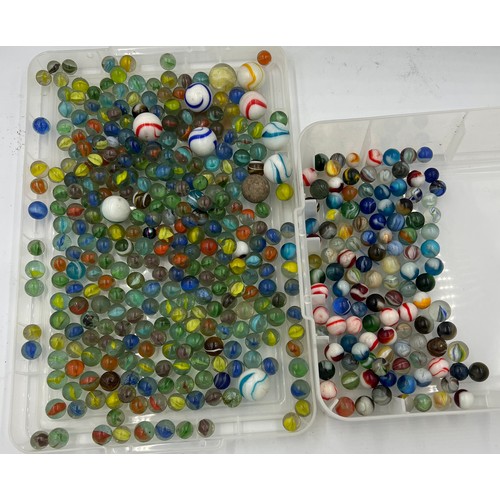 304 - A quantity of vintage glass marbles of varying sizes.