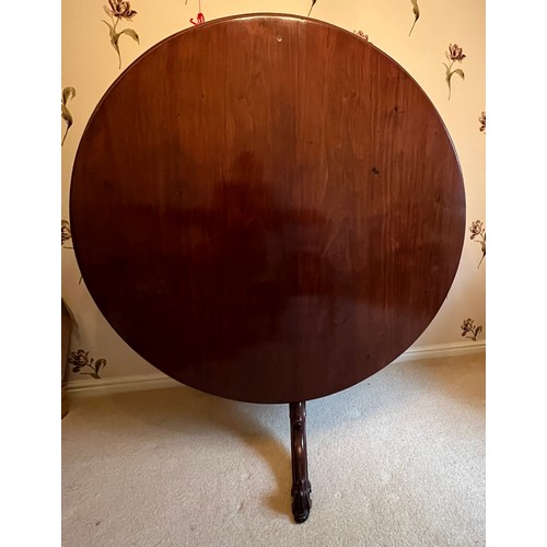 98 - A 19thC mahogany tilt top dining table 139cm d.