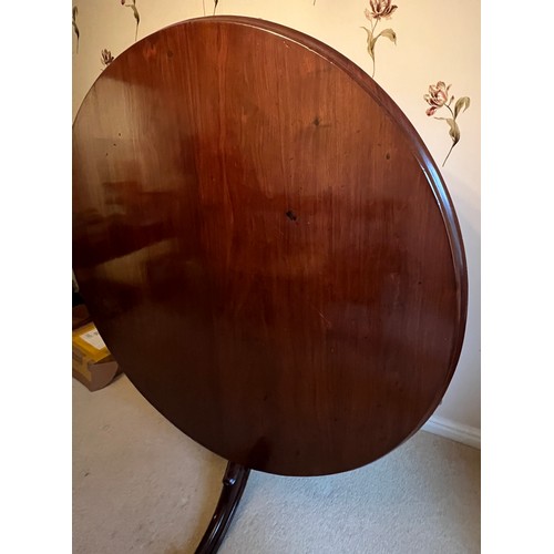 98 - A 19thC mahogany tilt top dining table 139cm d.