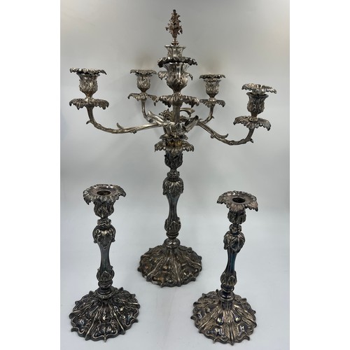 634 - A pair of 19thC silver plated candlesticks 31cm h and a five branch candelabra by Elkington & Co.- 6... 