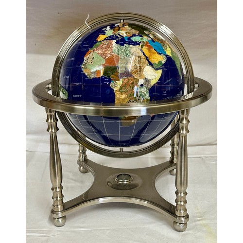 1032 - A terrestrial globe inset with lapis lazuli and semi-precious stones, supported by a frame inset wit... 