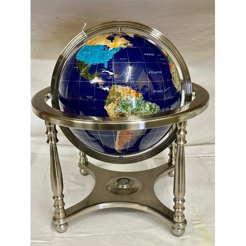 1032 - A terrestrial globe inset with lapis lazuli and semi-precious stones, supported by a frame inset wit... 