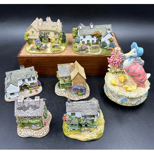 Various items relating to Beatrix Potter to include six Lilliput Lane  cottages and sculptures, boxed