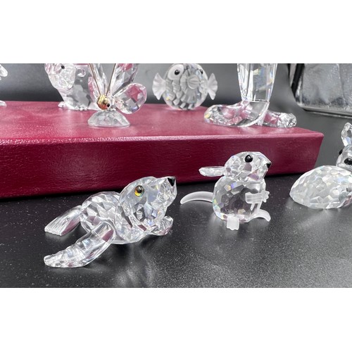 288 - A collection of 12 Swarovski Silver Crystal boxed ornaments to include 7644 Fish, 7616 Beaver, 7609 ... 