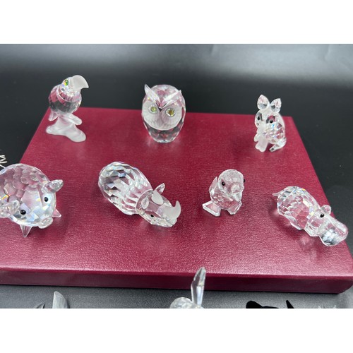 290 - A collection of Swarovski crystal to include 7638 pig, pelican, rhino, 7636 owl, hippo, fox, 7631 mo... 