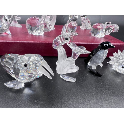 290 - A collection of Swarovski crystal to include 7638 pig, pelican, rhino, 7636 owl, hippo, fox, 7631 mo... 