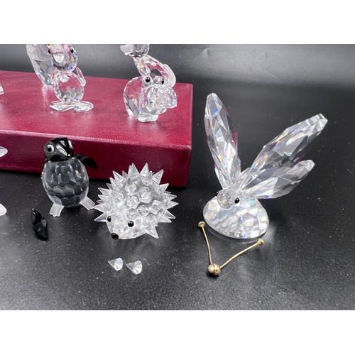 290 - A collection of Swarovski crystal to include 7638 pig, pelican, rhino, 7636 owl, hippo, fox, 7631 mo... 