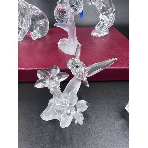 292 - Eight boxed pieces of Swarovski crystal to include 7637 Grizzly Bear measuring approx. 8.5cm h x 9cm... 