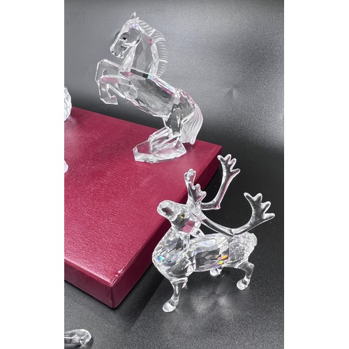 292 - Eight boxed pieces of Swarovski crystal to include 7637 Grizzly Bear measuring approx. 8.5cm h x 9cm... 