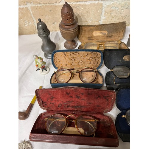 1030 - An interesting miscellany to include pewter pepperette, treen sifter, vintage spectacles, glass and ... 