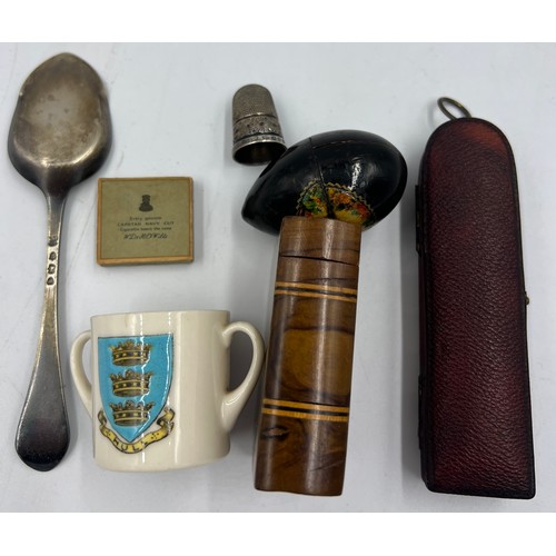 1028 - A miscellaneous lot to include a miniature leather cased thermometer, hallmarked silver preserve spo... 