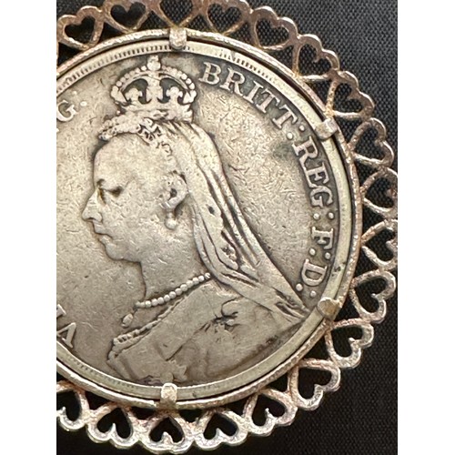 500 - Silver crown 1891 Queen Victoria in a white metal mount on a white metal chain with part of the clas... 