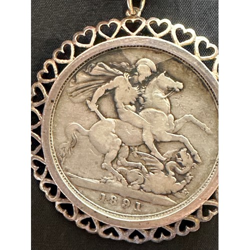 500 - Silver crown 1891 Queen Victoria in a white metal mount on a white metal chain with part of the clas... 