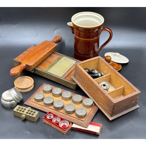 1027 - A group of pharmaceutical items to include a mahogany and brass pill machine 31cm l, by J. W. Pindar... 