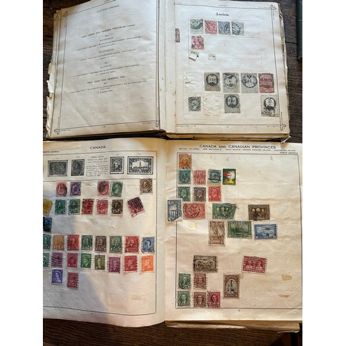 587 - Four world printed albums with mainly world stamps, some GB.