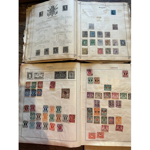 587 - Four world printed albums with mainly world stamps, some GB.