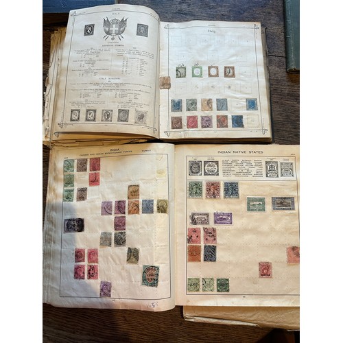 587 - Four world printed albums with mainly world stamps, some GB.