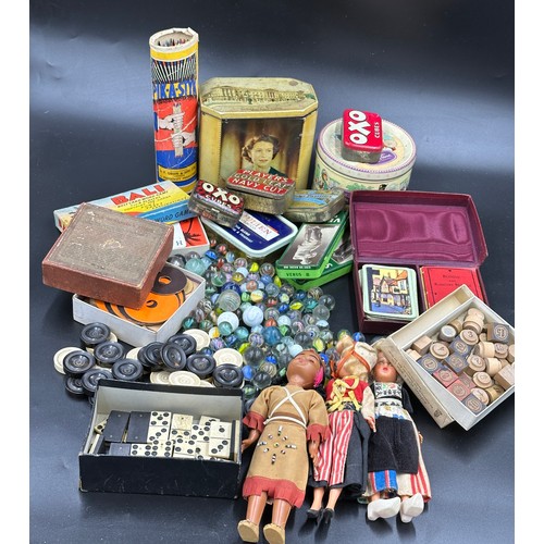 864 - Collection of vintage toys and tins to include marbles, bone dominoes, draughts, card games and 3 so... 