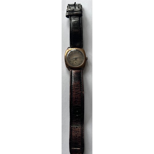 565 - A rolled gold automatic cushion wristwatch with subsidiary seconds dial on brown leather strap.