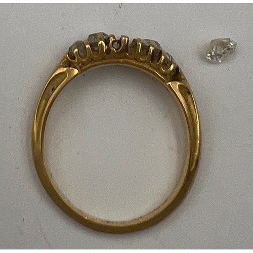 491 - Five stone diamond ring set in unmarked yellow metal. Central stone loose and needs resetting. Size ... 