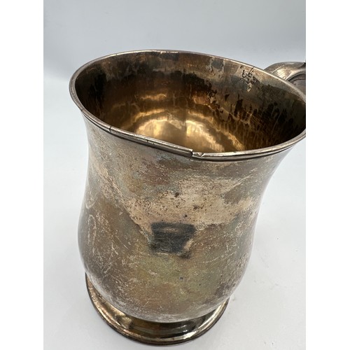 731 - A George II silver tankard, London 1747, makers marks rubbed. 12cm h. Weight 373gm.