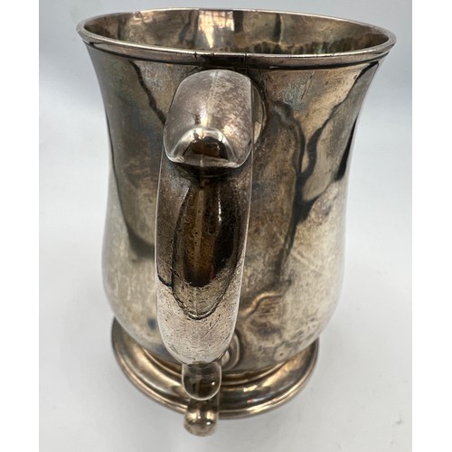 731 - A George II silver tankard, London 1747, makers marks rubbed. 12cm h. Weight 373gm.