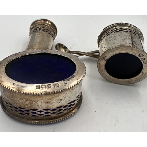 737 - Three piece silver cruet, salt and mustard spoon, with blue glass liners. Silver weight 82gm.