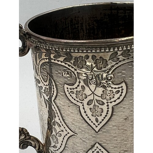 740 - A silver tankard London 1866, maker GA 8.5cm h. Weight 142gm.