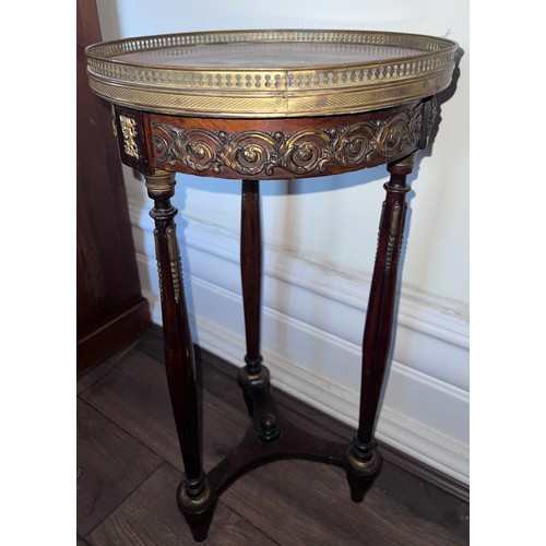 109 - A continental gueridon with brass mounts and galleried top with marble inset top. 34cm d top x 64cm ... 