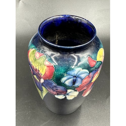 262 - A Moorcroft vase in the orchid pattern, signed to base. Height 15cm .