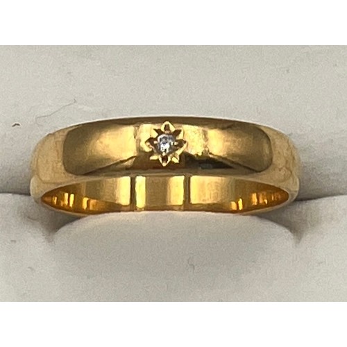 501 - A 22 carat gold wedding band set with diamond. Size U. Weight 5gm.