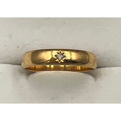 501 - A 22 carat gold wedding band set with diamond. Size U. Weight 5gm.