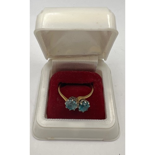 502 - An 18 carat gold ring set with blue stones. Size Q. Weight 3.5gm.