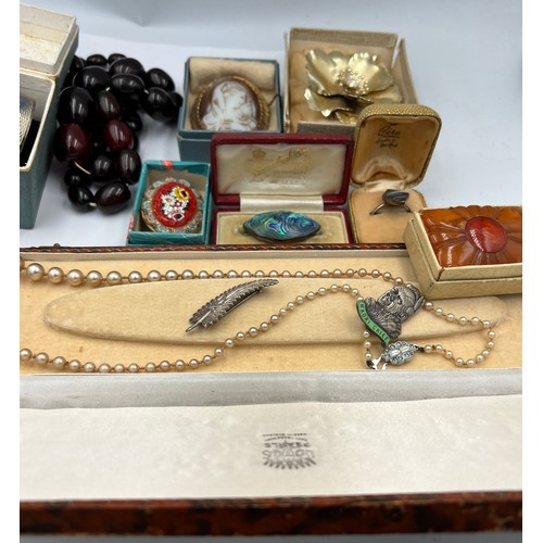 323 - A quantity of costume jewellery to include hallmarked silver napkin ring, micro mosaic brooch, brooc... 