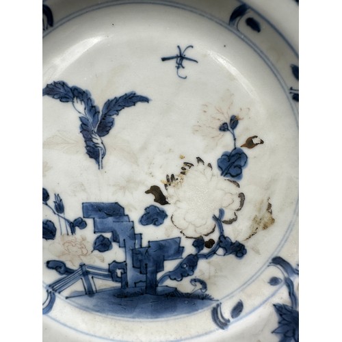 264 - A Nanking Cargo porcelain plate, decorated in underglaze blue, with Christies lot label. Approx 23cm