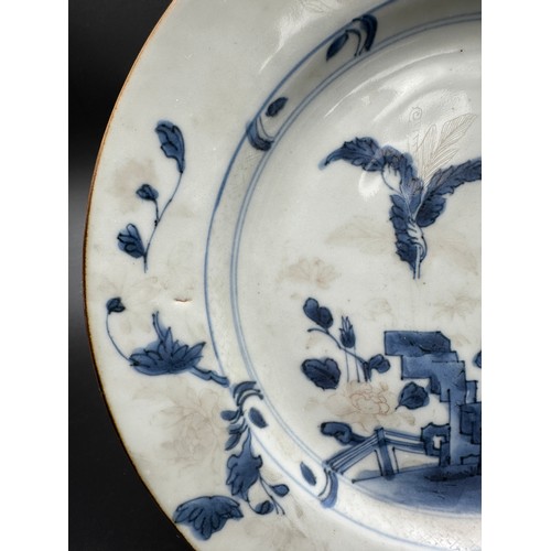 264 - A Nanking Cargo porcelain plate, decorated in underglaze blue, with Christies lot label. Approx 23cm