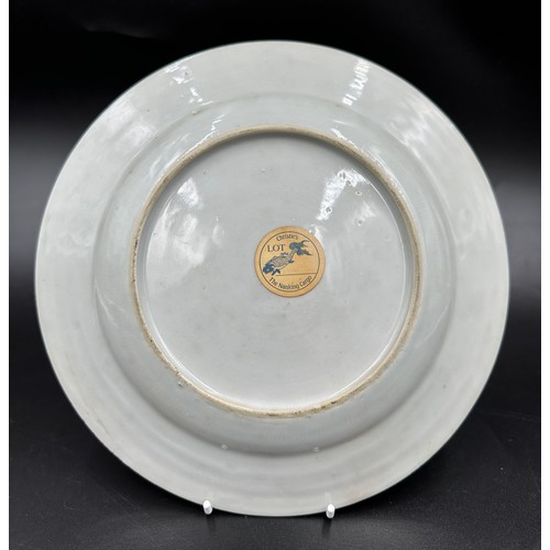 264 - A Nanking Cargo porcelain plate, decorated in underglaze blue, with Christies lot label. Approx 23cm