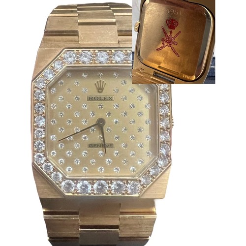 Fine and rare Rolex Genéve Cellini 18k gentleman's bracelet watch, ref. 4951/8, circa 1981, serial no. 6944773, octagonal diamond set bezel and diamond encrusted face, mechanical movement, Rolex crown. On the reverse of the watch is an engraving of the Sultanates' official emblem, a pair of red crossed swords and sheathed Khanjar.  Above the official emblem is a crown which, in association of the state emblem, is the official personal mark of the Sultan himself. 126.22gm, 26mm. With the original box and insurance valuation from Rolex dated 1986 and others.
Provenance: Gifted to the chief engineer of The Sultanate of Oman Royal Yacht between 1984 and 1990 and was presented with this watch by Sultan Qaboos Bin Said following a very successful voyage in 1986.