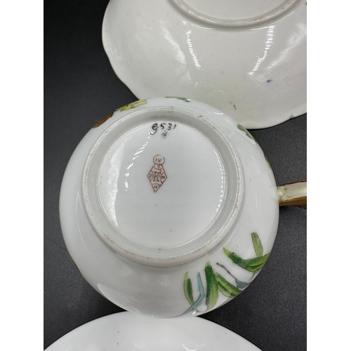 271 - Four 19thC cups and saucers to include two with lozenge marks to base, a Minton with butterfly handl... 