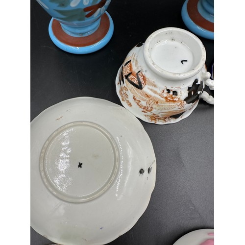 271 - Four 19thC cups and saucers to include two with lozenge marks to base, a Minton with butterfly handl... 