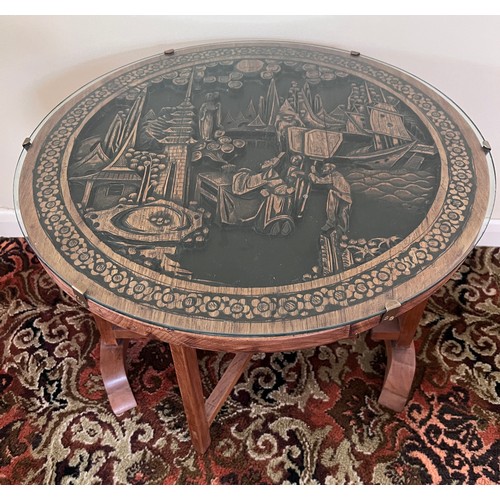 116 - An oriental carved circular table. Top 61 diam x 51cm h.