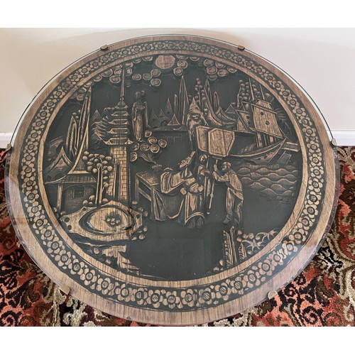 116 - An oriental carved circular table. Top 61 diam x 51cm h.