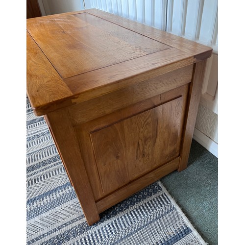 117 - An oak blanket box with carved panels to front. 84 w x 48 d x 53cm h.