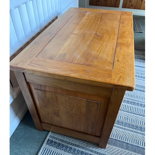 117 - An oak blanket box with carved panels to front. 84 w x 48 d x 53cm h.