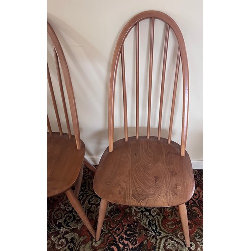 118 - Four Ercol stickback dining chairs.