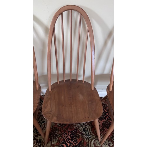 118 - Four Ercol stickback dining chairs.